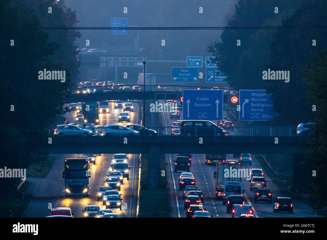 Motorway A40, Ruhrschnellweg, near Bochum, Germany, heavy after work traffic, in the evening,  in front of the motorway junction Bochum, A43,  view in Stock Photo