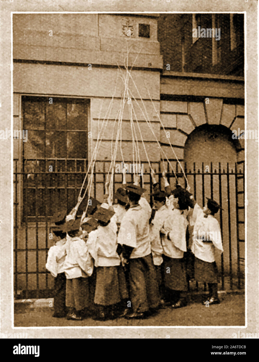 Traditional British often annual customs and ceremonies. - A circa 1940 photograph of the choristers of St Clement Danes, London beating the bounds (marking the parish boundary) using long sticks or 'willow wands' Stock Photo