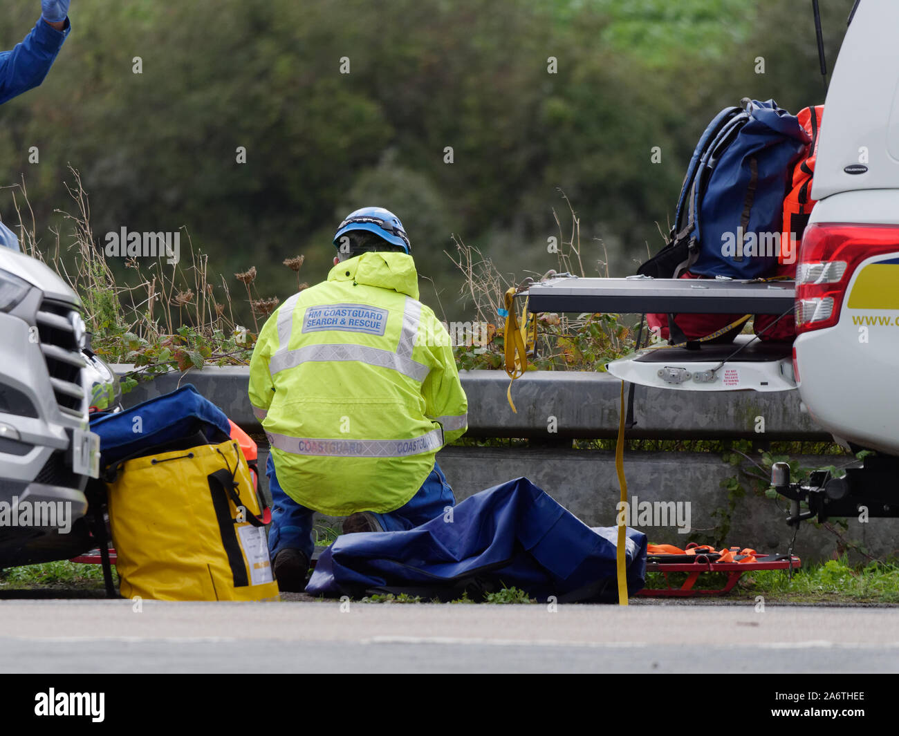 Coastguard service members aid Ambulance and police in a body recovery, Newquay Cornwall UK Stock Photo