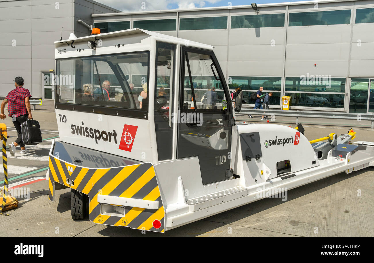 BRISTOL, ENGLAND - AUGUST 2019: Aircraft tug with the logo of operator Swissport at Bristol Airport. Stock Photo