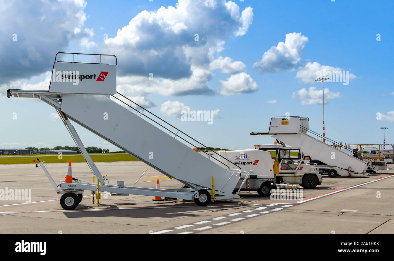 BRISTOL, ENGLAND - AUGUST 2019: Airport ground handling equipment operated by specialist contractor Swissport at Bristol Airport. Stock Photo