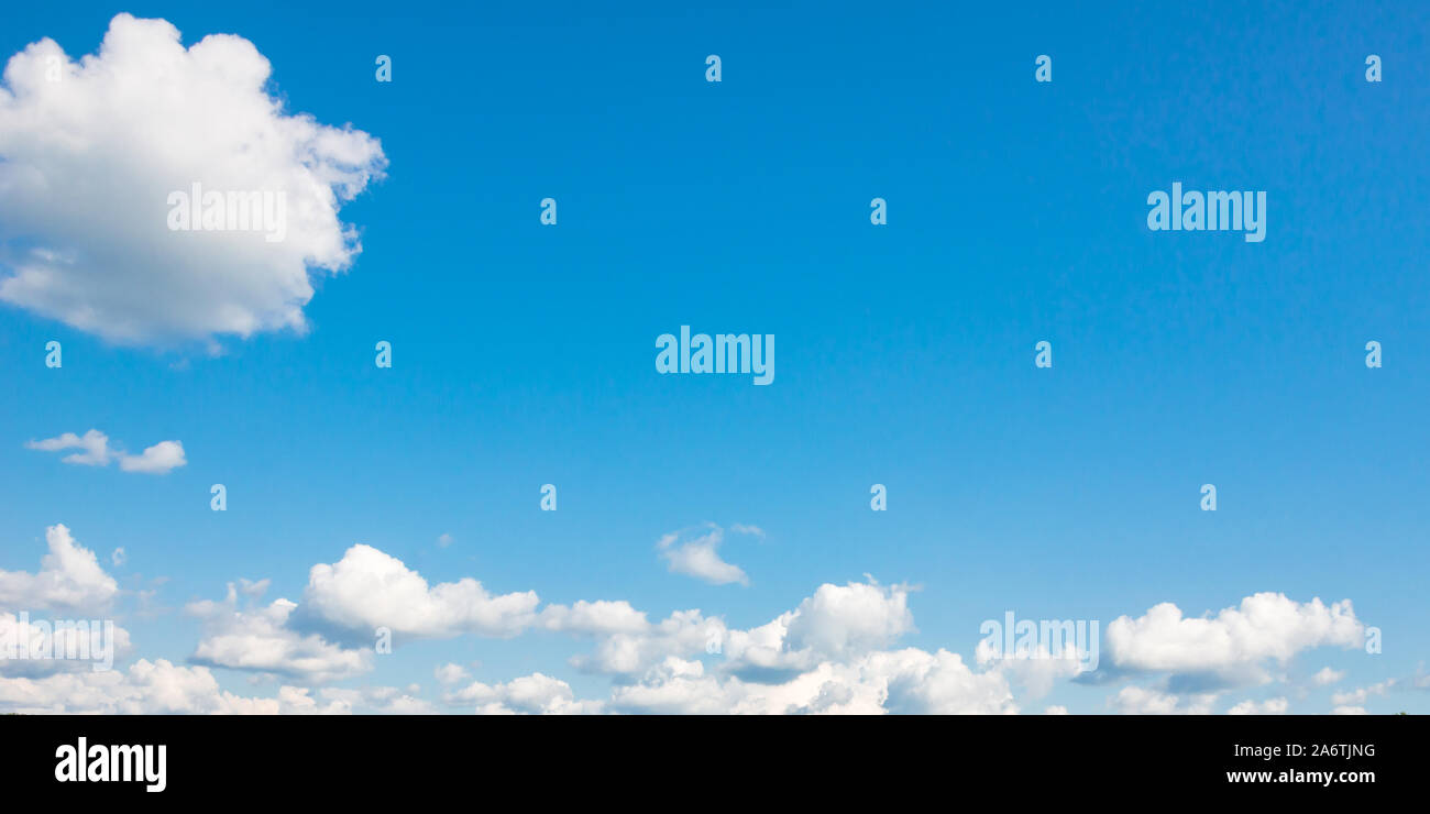 Blue sky with white cumulus clouds at day. Panoramic background photo ...