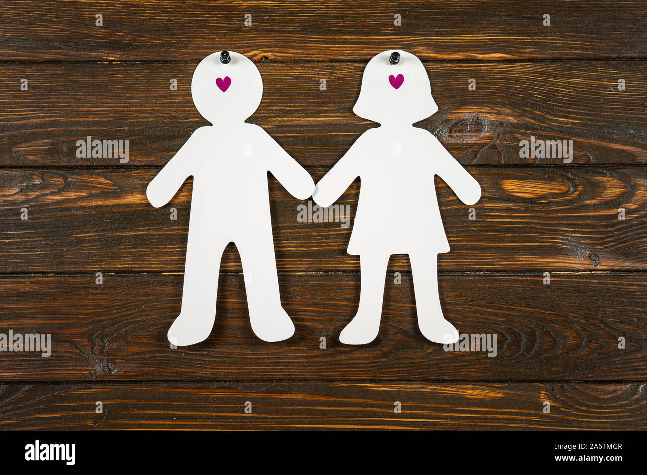 Large paper people shapes.Love concept Stock Photo - Alamy