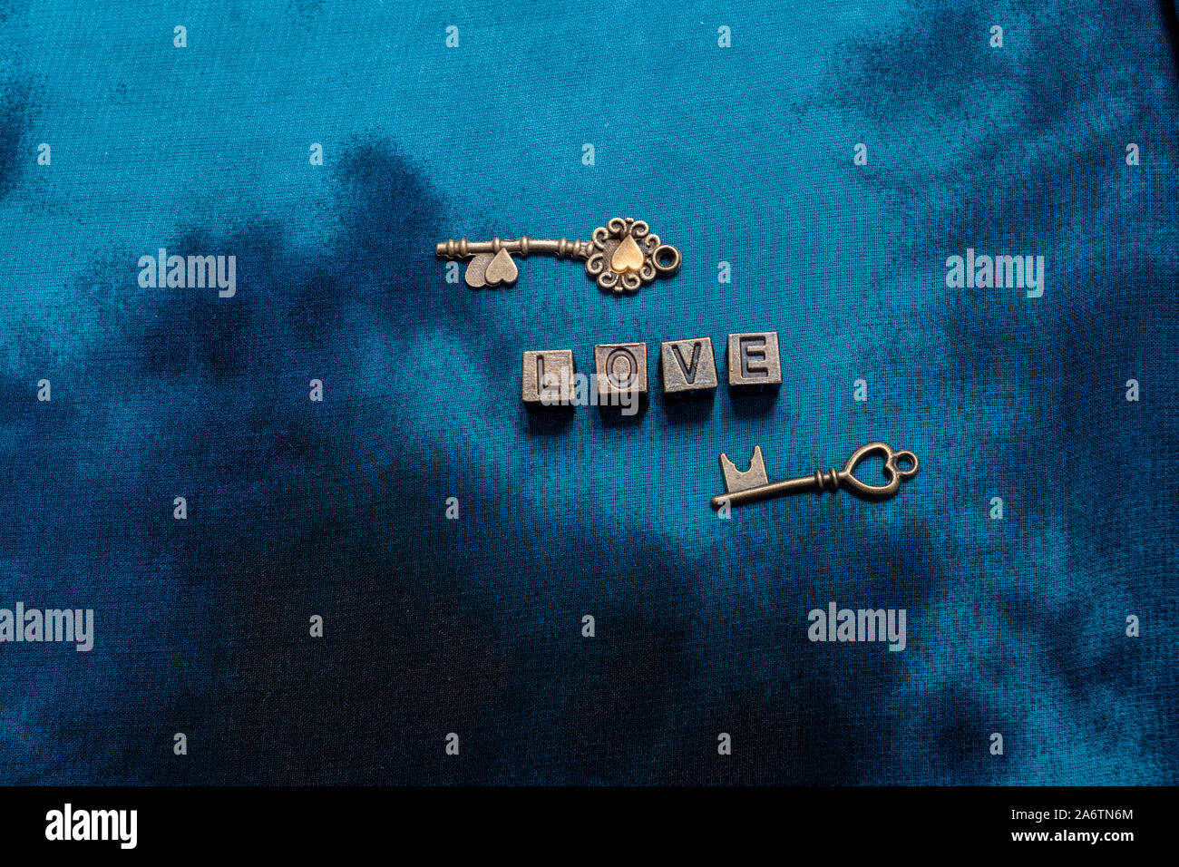 Ornamental keys around the Love wording with retro metal letters Stock Photo