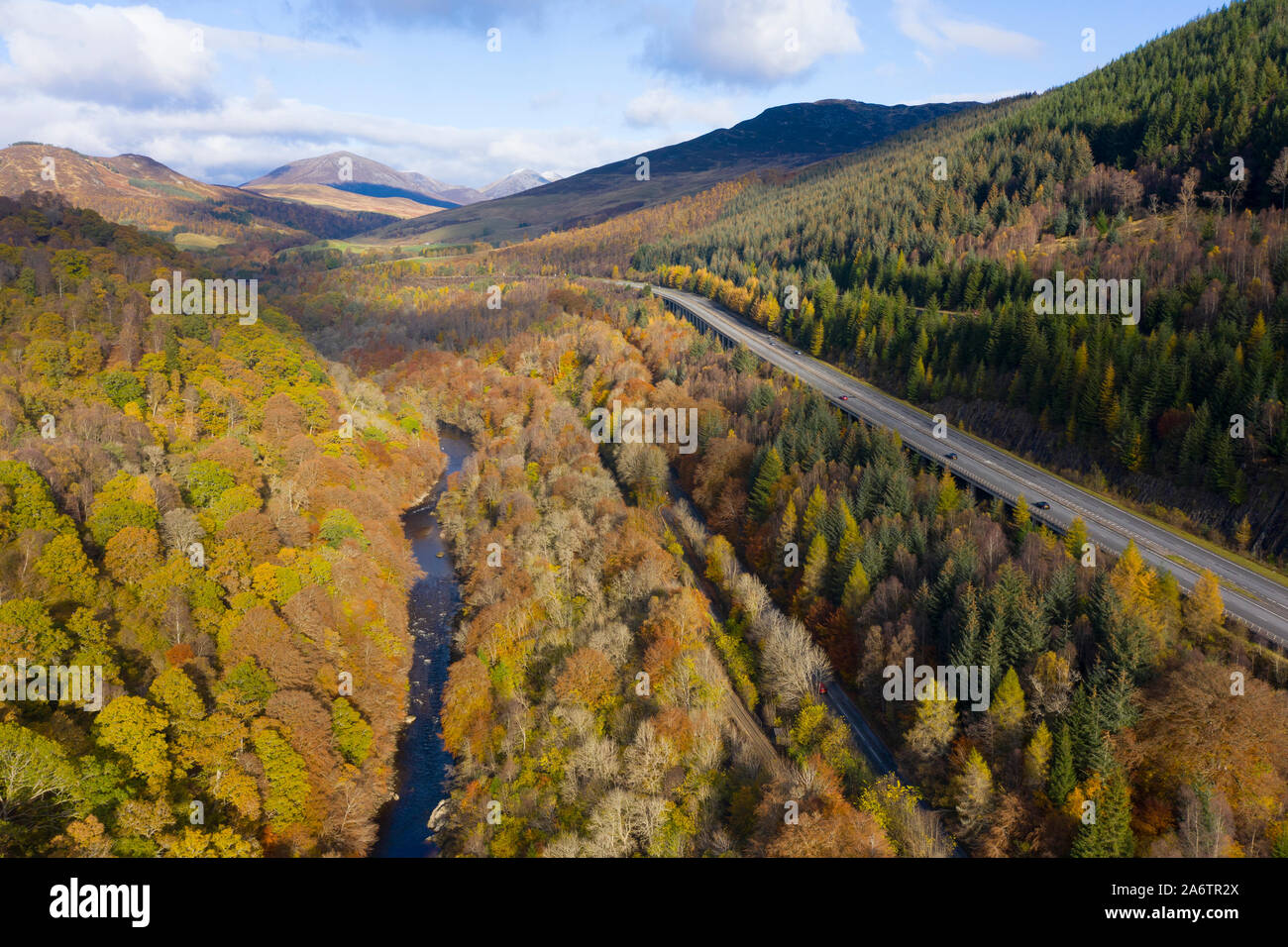 Transport corridor through the Pass of Killiecrankie in Perthshire, Scotland, UK. River Garry to left, mainline railway, B8079 and A9 to right. Stock Photo