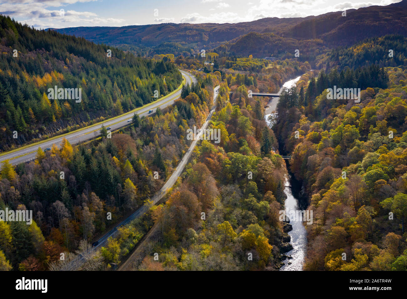 Transport corridor through the Pass of Killiecrankie in Perthshire, Scotland, UK. River Garry to right, mainline railway, B8079 and A9 to left. Stock Photo