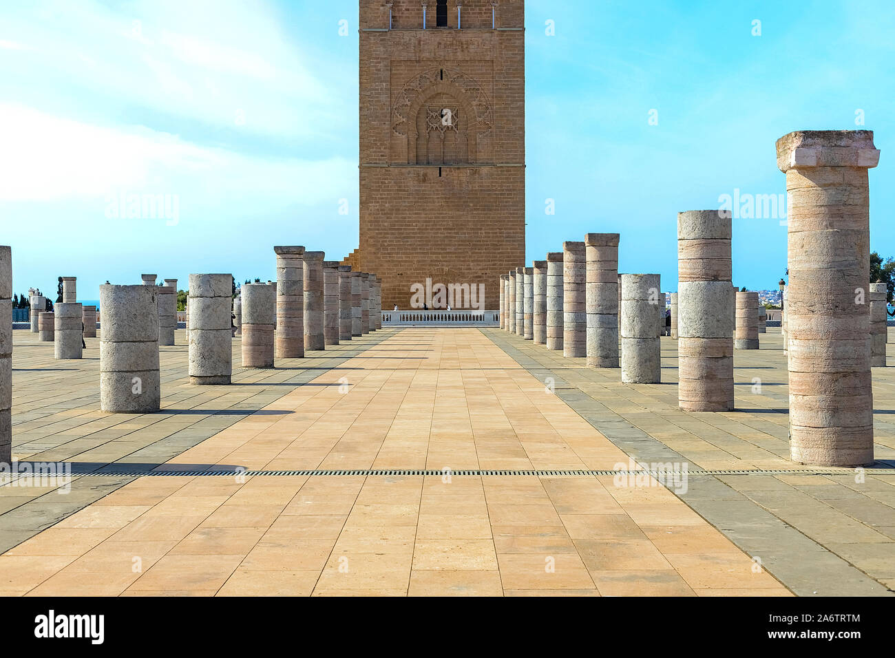 View of the square with ruins and the Hassan tower against the blue sky. Traditional Arabian architecture Rabat, Morocco 22.04.2019 Stock Photo