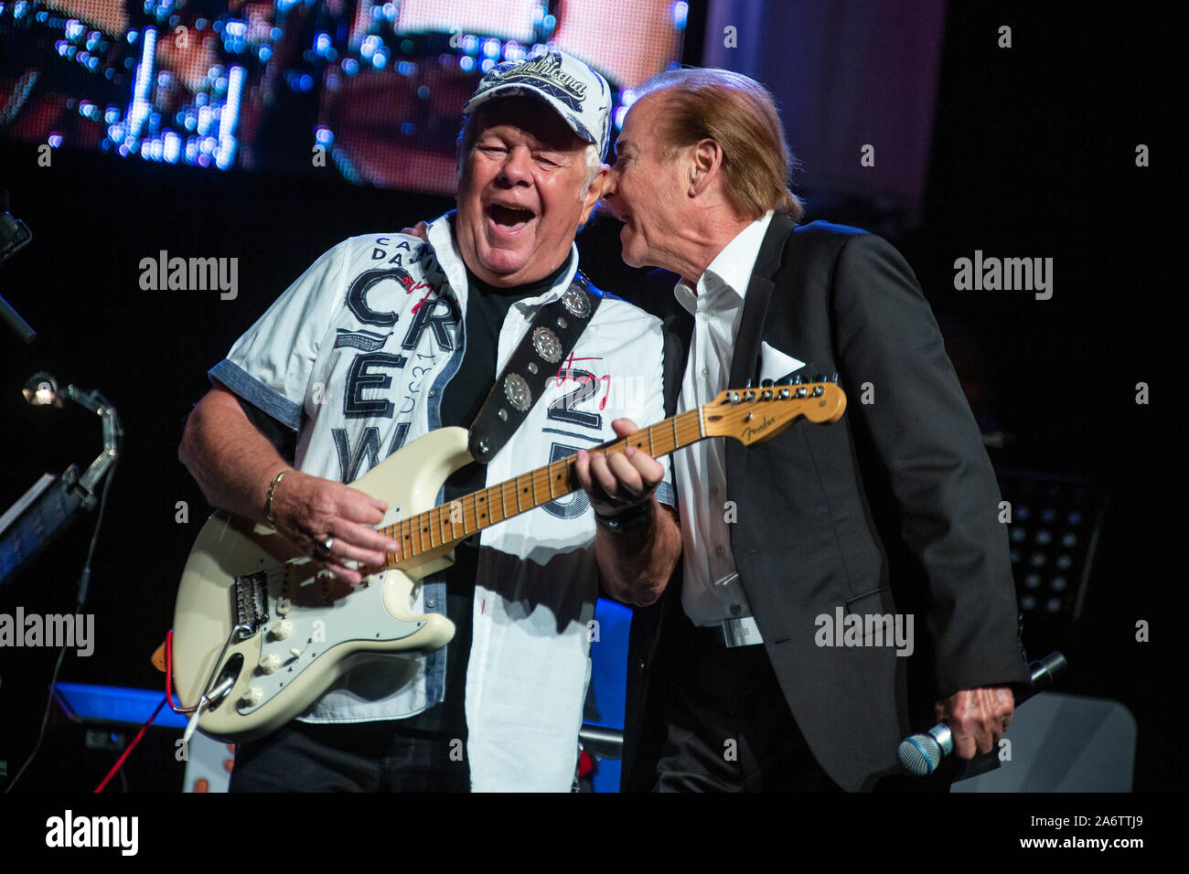 British pop singer Graham Bonney (hit 'Super Girl') and German singer Michael Holm (hit 'Mendocino' as German adaption) are performing at Schlager music show Schlagerlegenden, with schlager music stars of the 1960s and 1970s Ireen Sheer, Peggy March, Lena Valaitis, Graham Bonney, Michael Holm and Orchester Otti Bauer. At Stadthalle Wetzlar, Wetzlar, Germany, 27th Oct, 2019. Credit: Christian Lademann Stock Photo