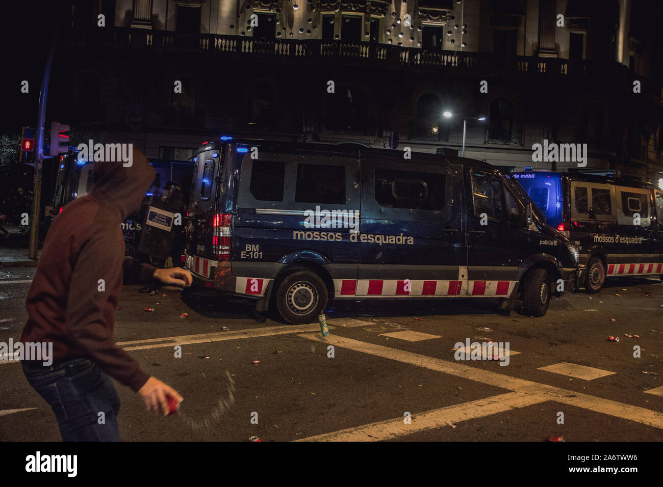 Protester throws a can to the van of the Mossos d'Esquadra in Via Laietana, Barcelona, Spain Stock Photo