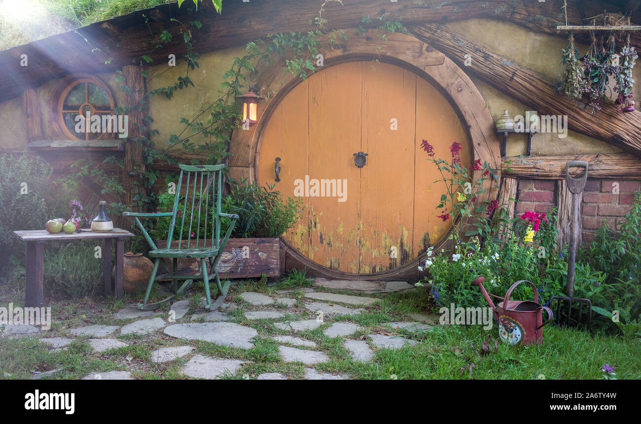 Early morning sunshine on a hobbit house in the Hobbiton movie set location Stock Photo