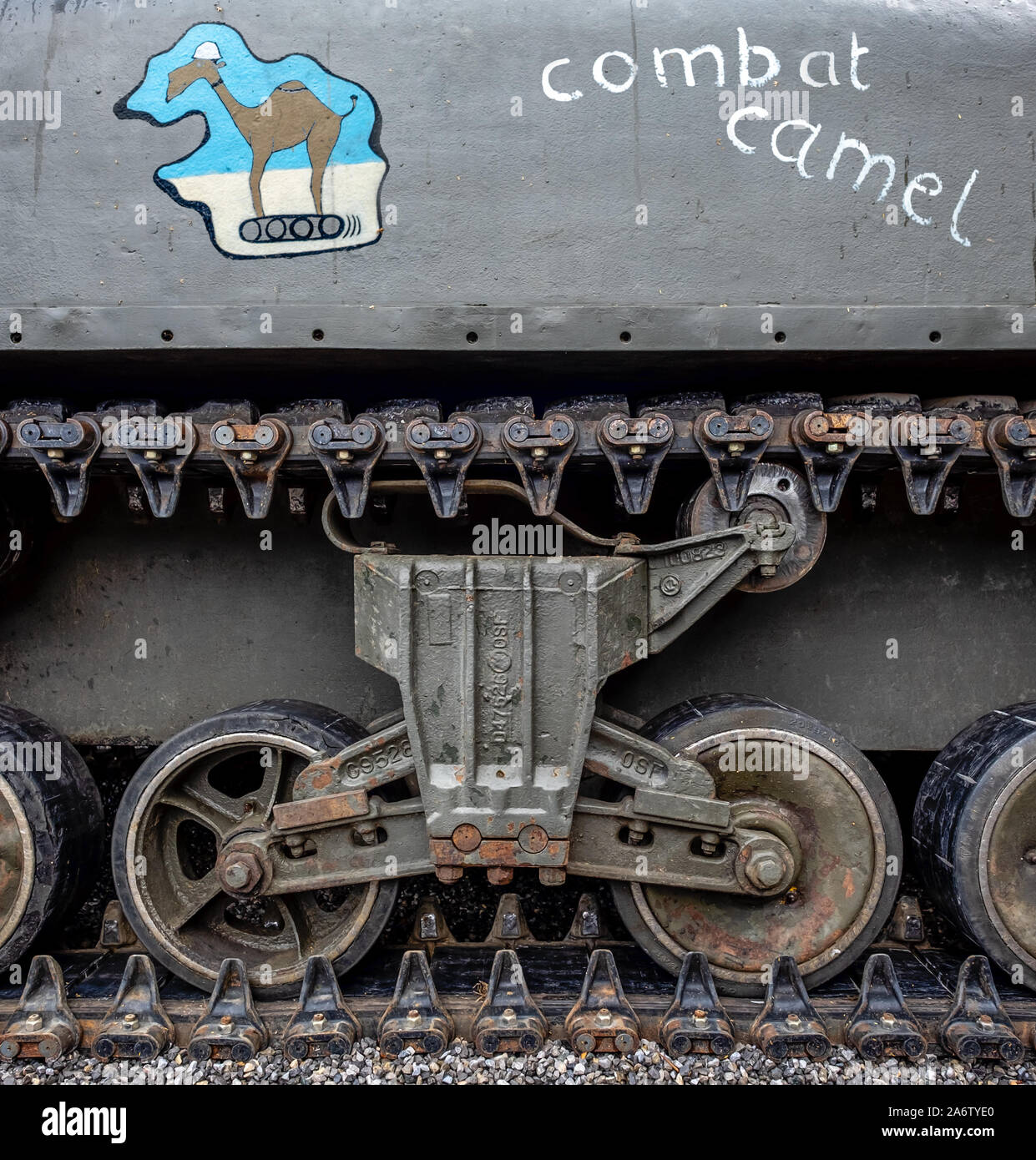 Detail of the wheels and track of a Sherman tank with decoration and text. Stock Photo