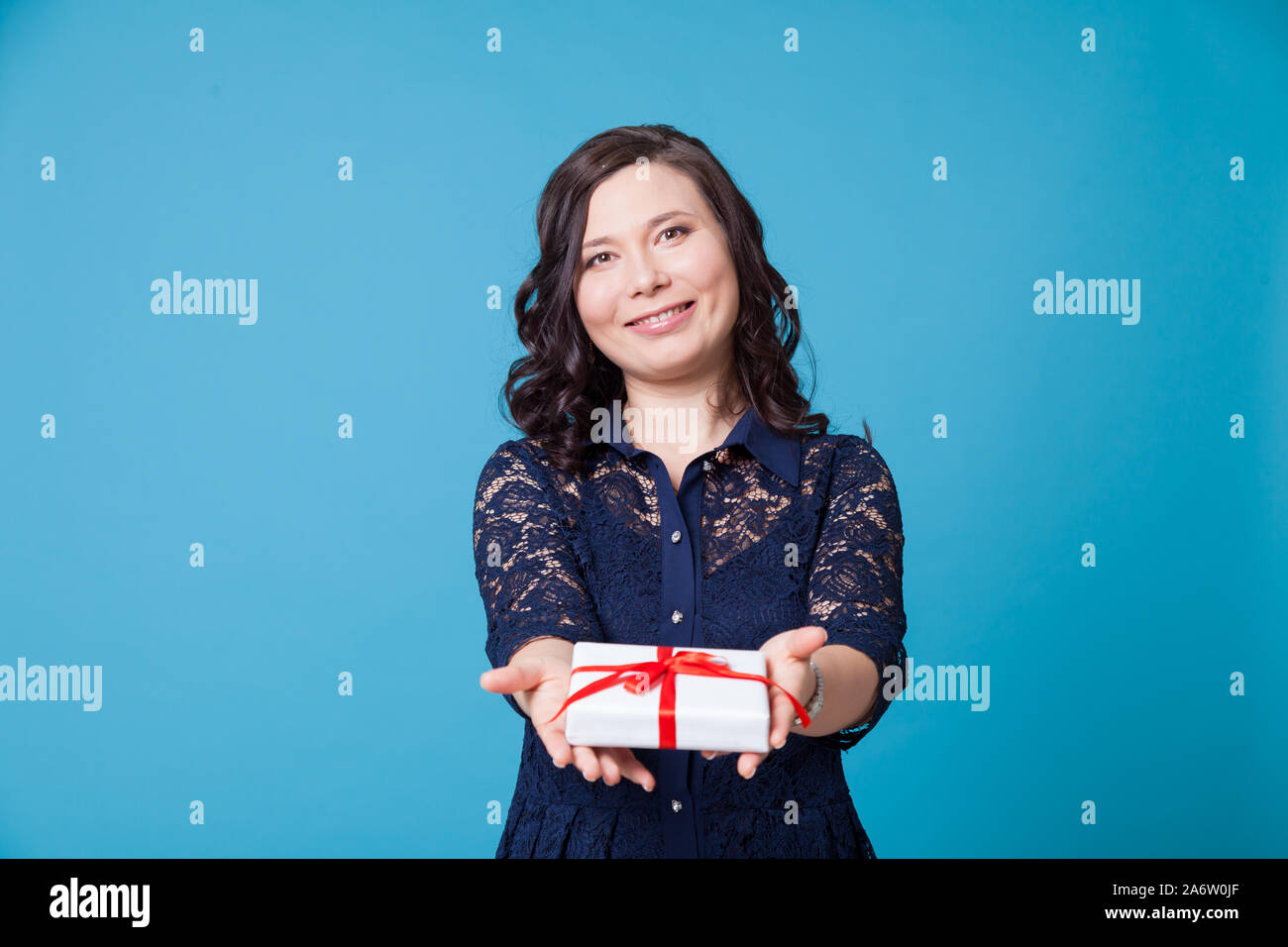 Beautiful Asian woman holds a birthday present Stock Photo