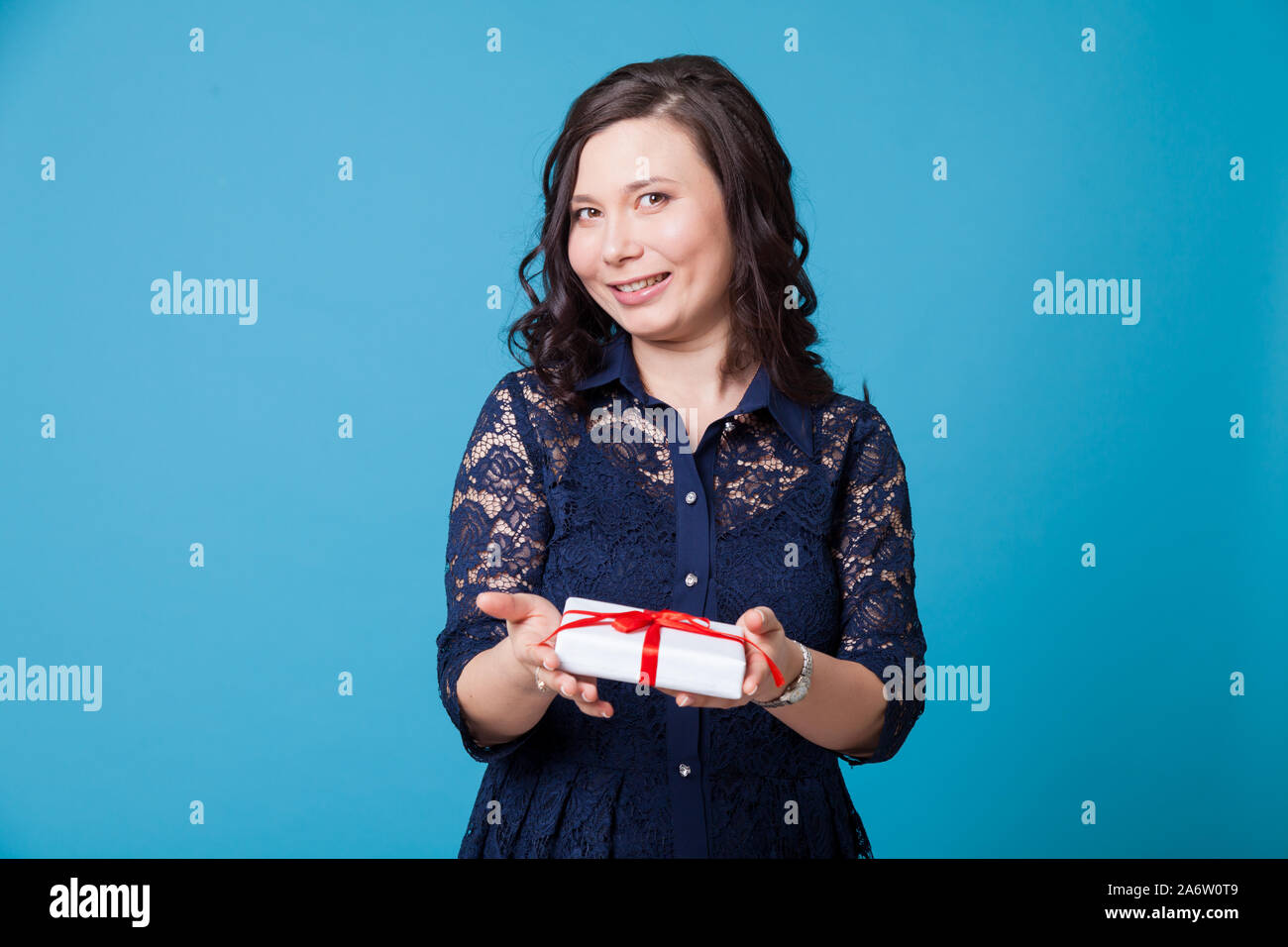 Beautiful Asian woman holds a birthday present Stock Photo