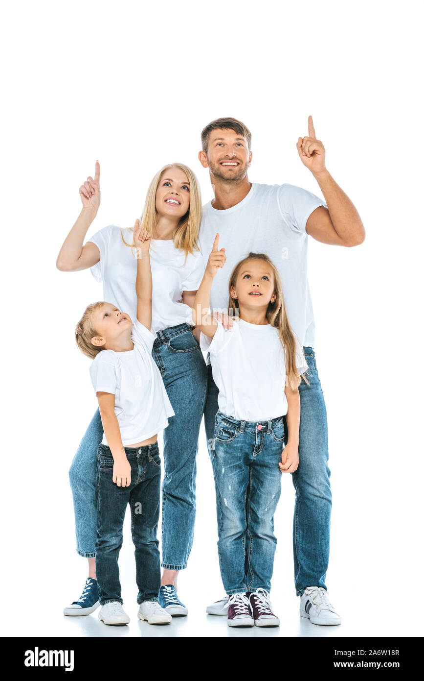 happy family looking up and pointing with fingers on white Stock Photo