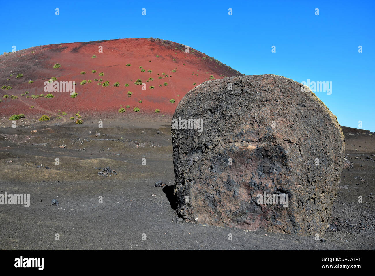 The big lava bomb near the red volcano Montana Colorada in Lanzarote, Spain. Stock Photo
