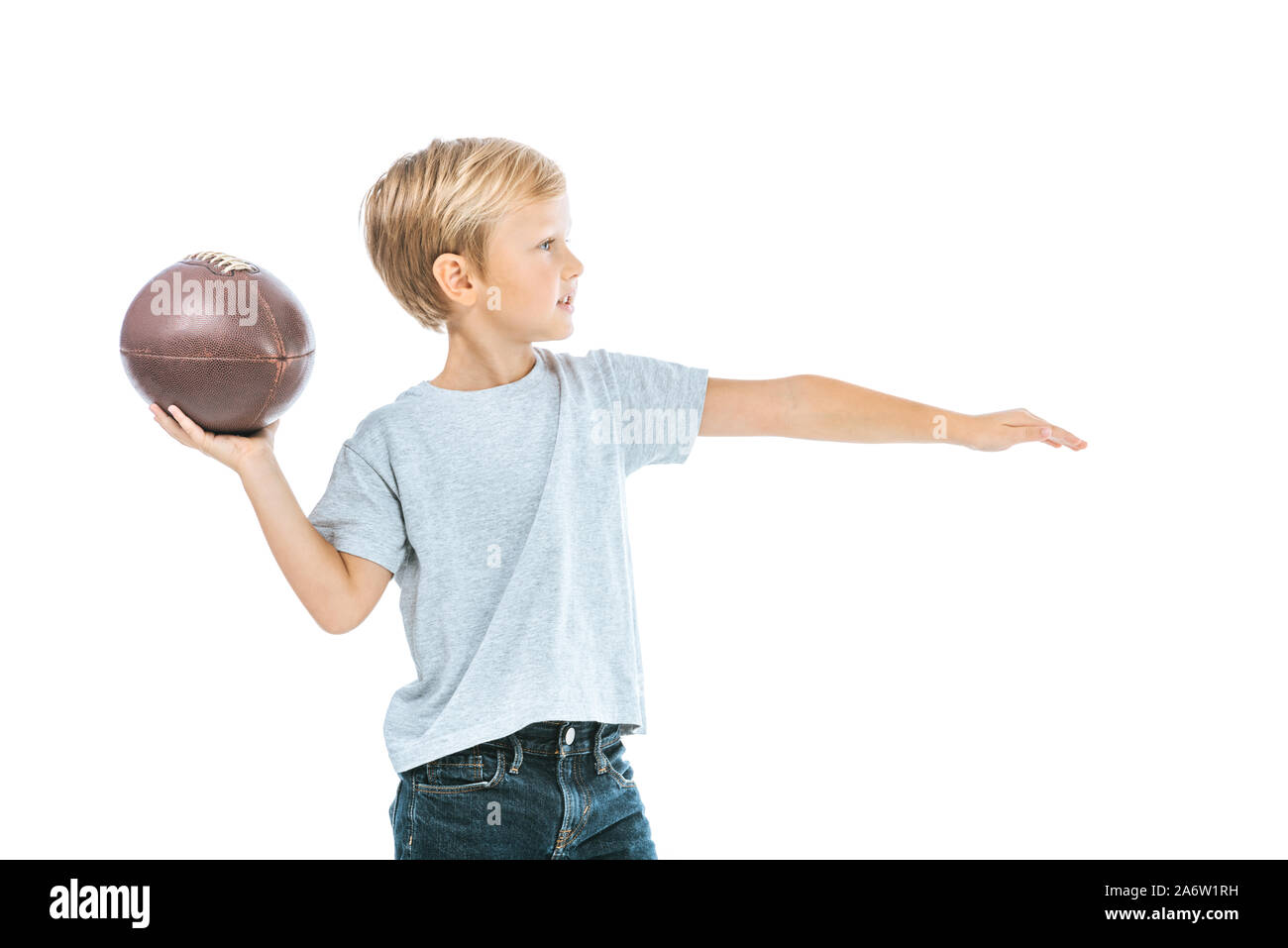 side view of boy holding rugby ball isolated on white Stock Photo Alamy
