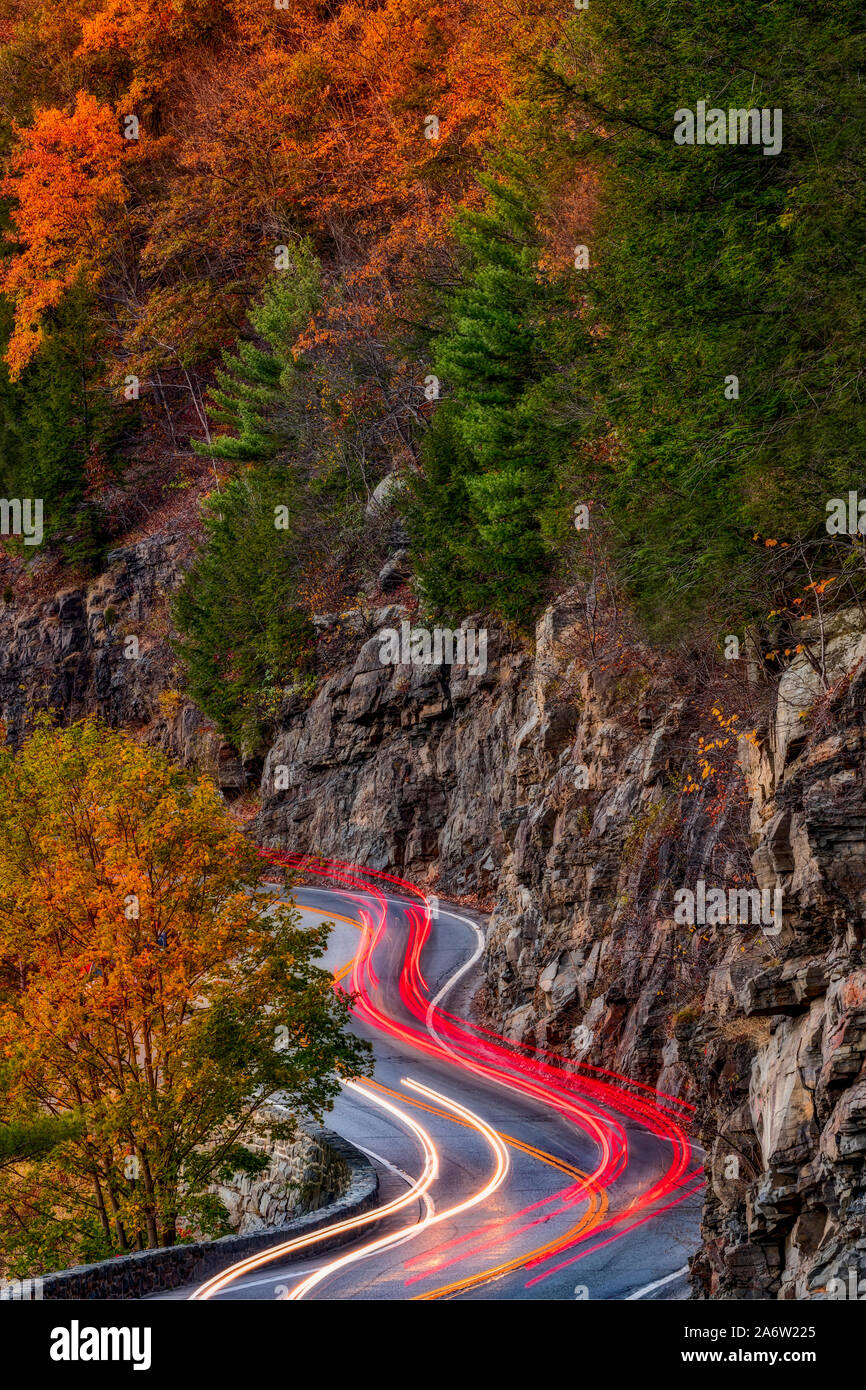 Hawks Nest Route 97- Car trails along the winding route 97 during the autumn foliage season in Sparrow Bush, New York. Stock Photo