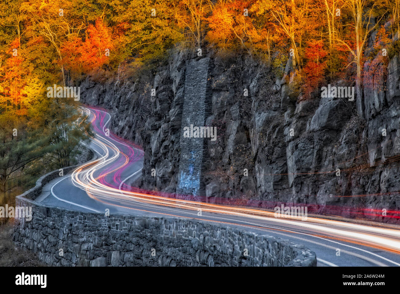 Hawks Nest Road - Car trails along the winding road during autumn in Port Jervis, New York. Stock Photo