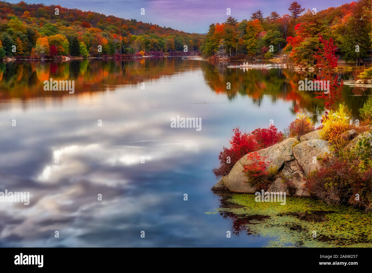 Harriman State Park In Autumn - View to the magnificent colors of fall foliage and reflections on the calm waters at Harriman State Park in New York. Stock Photo