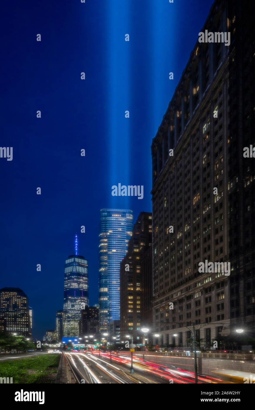 A NYC Tribute In light - View to traffic leading to and from One World Trade Center, commonly known as the Freedom Tower and to lights beamimg high in Stock Photo