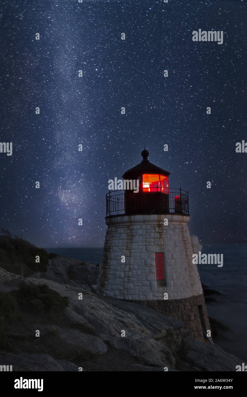 Milky Way Rising Over Castle Hill - A star filled sky with the galactic core of the Milky Way next to Castle Hill Lighthouse on Narragansett Bay in Ne Stock Photo