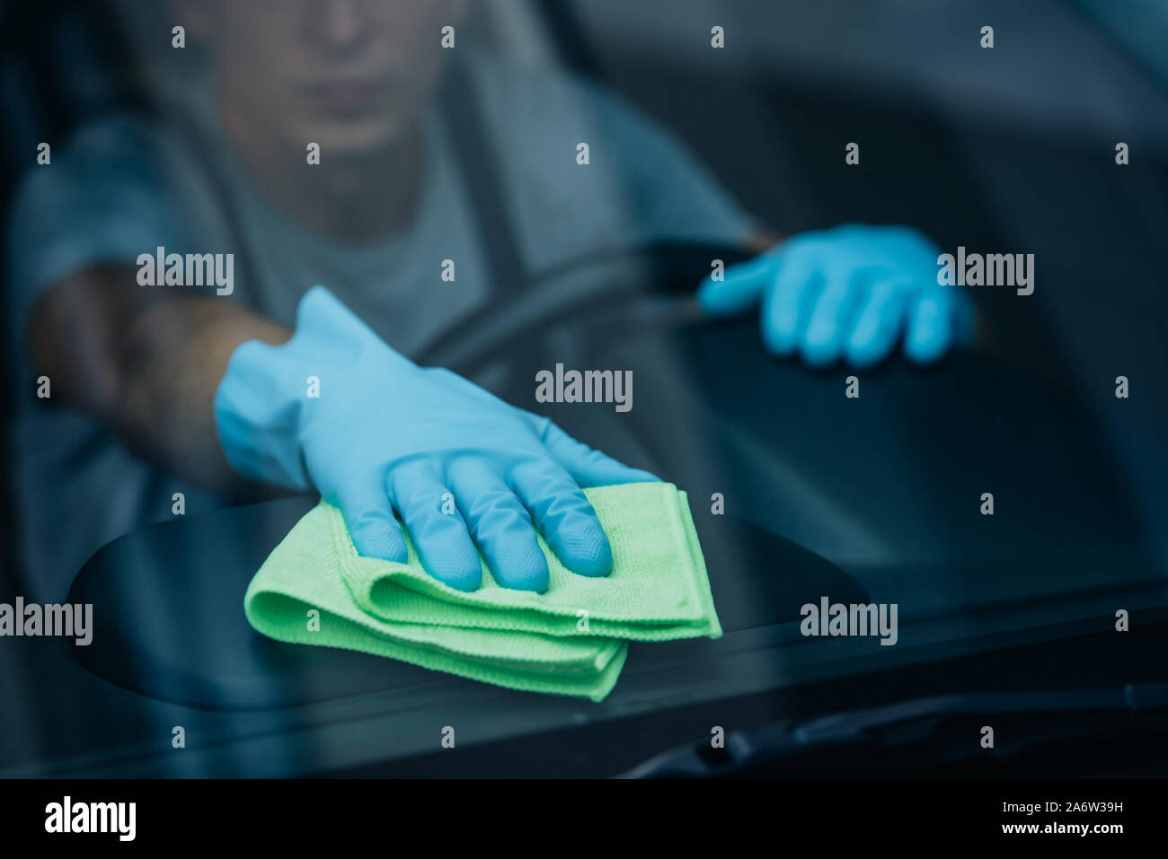 Worker Wiping Car Windshield Stock Photo - Alamy