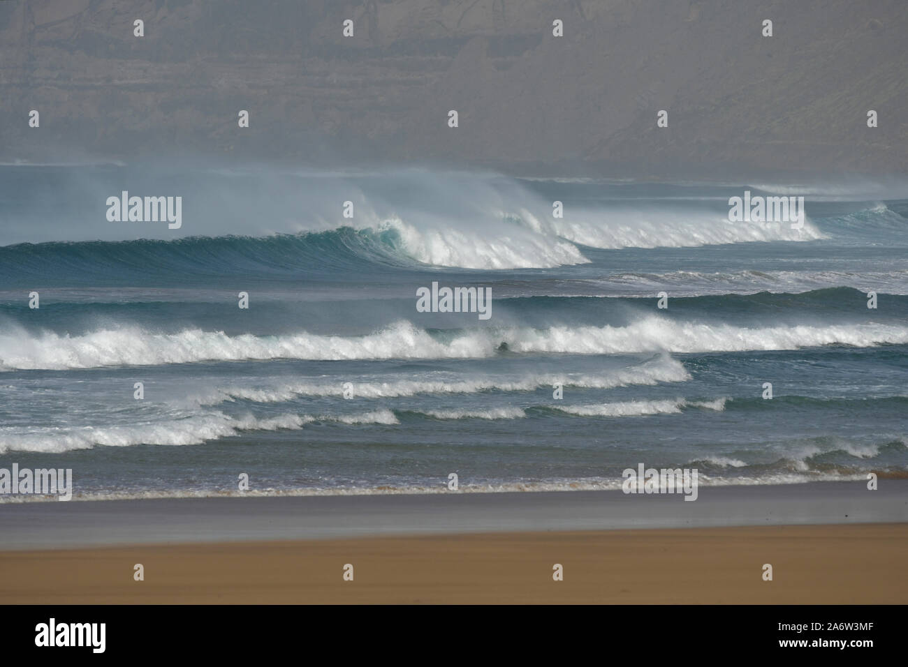 High waves at Famara beach while the Calima wind is blowing, Lanzarote, Spain. Stock Photo