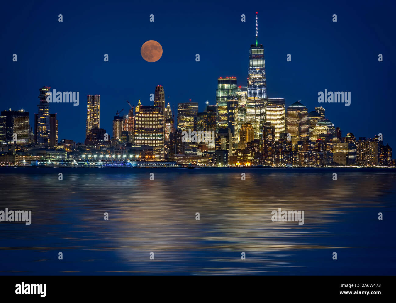 Downtown NYC Skyline  - The NYC skyline with the One World Trade Center WTC commonly known as the Freedom Tower along with a super moon.    This image Stock Photo