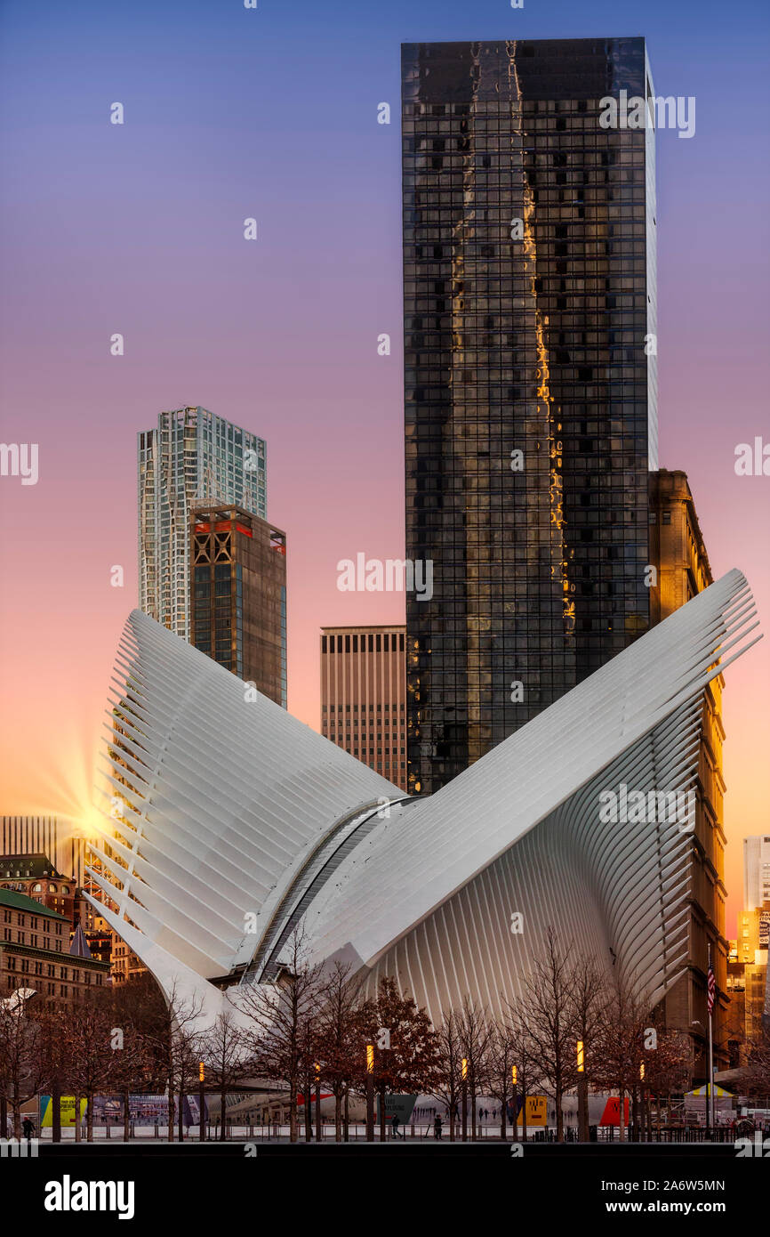 Oculus Transportation Hub with the rising sun at lower Manhattan in Stock Photo