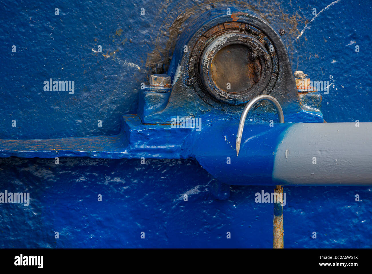 roller Boat showing a rusted fishing hook docked at the Provincetown Marina at Fisherman's Wharf in Cape Cod. Stock Photo
