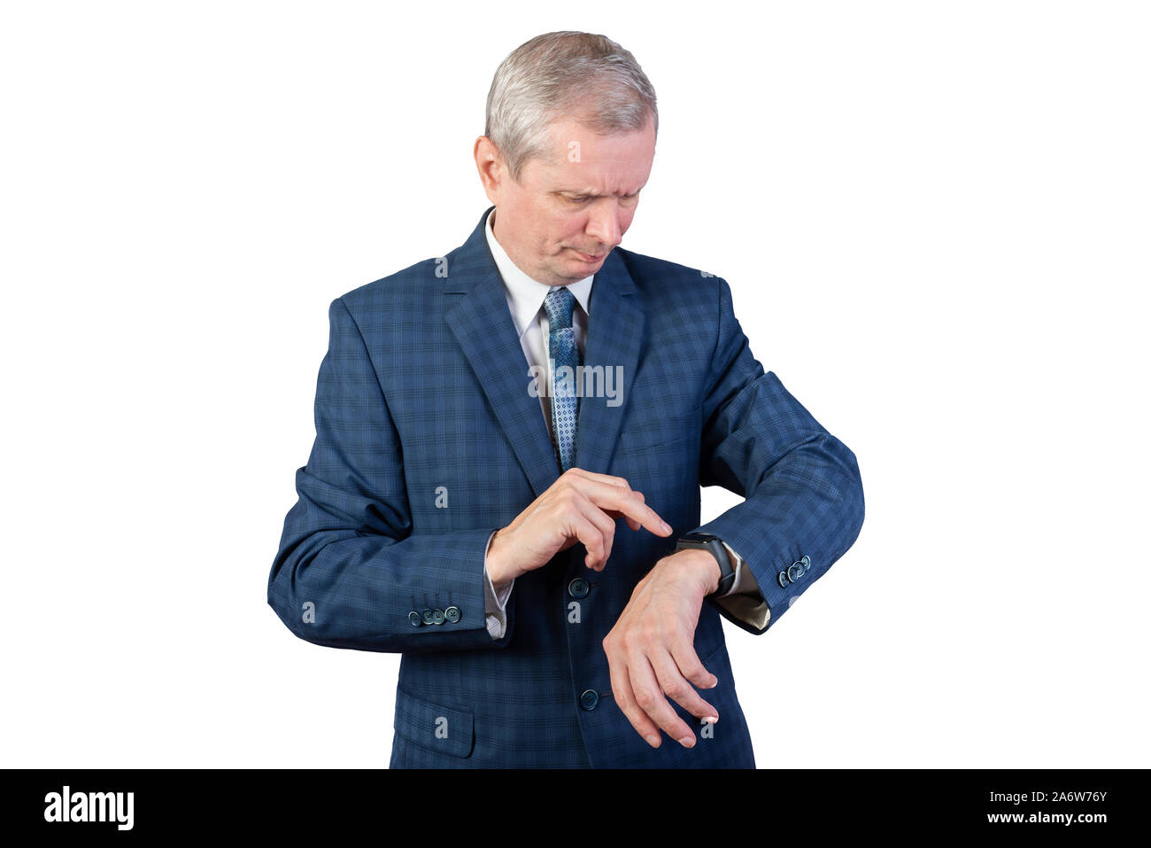 An elderly man in a suit measures the pulse of a fitness bracelet. Isolated on a white background. Stock Photo
