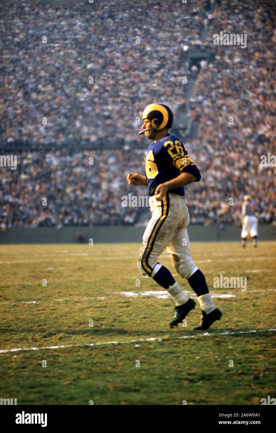 LOS ANGELES, CA - NOVEMBER 10:  Jon Arnett #26 of the Los Angeles Rams runs off the field during an NFL game against the San Francisco 49ers on November 10, 1957 at the Los Angeles Memorial Coliseum in Los Angeles, California.   (Photo by Hy Peskin) Stock Photo