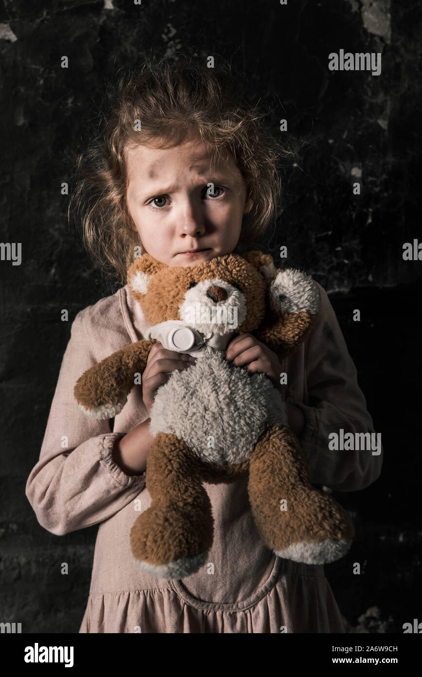 child with teddy bear