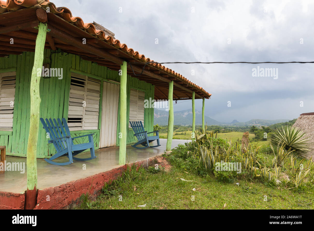 Typical Cuban veranda with rocking chairs in valley of Vinales Stock Photo