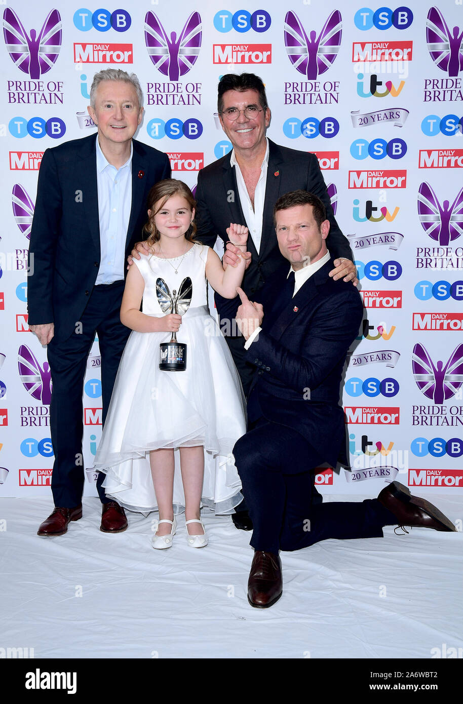 JaydeeLee Dummett with her Child of Courage award poses with Louis