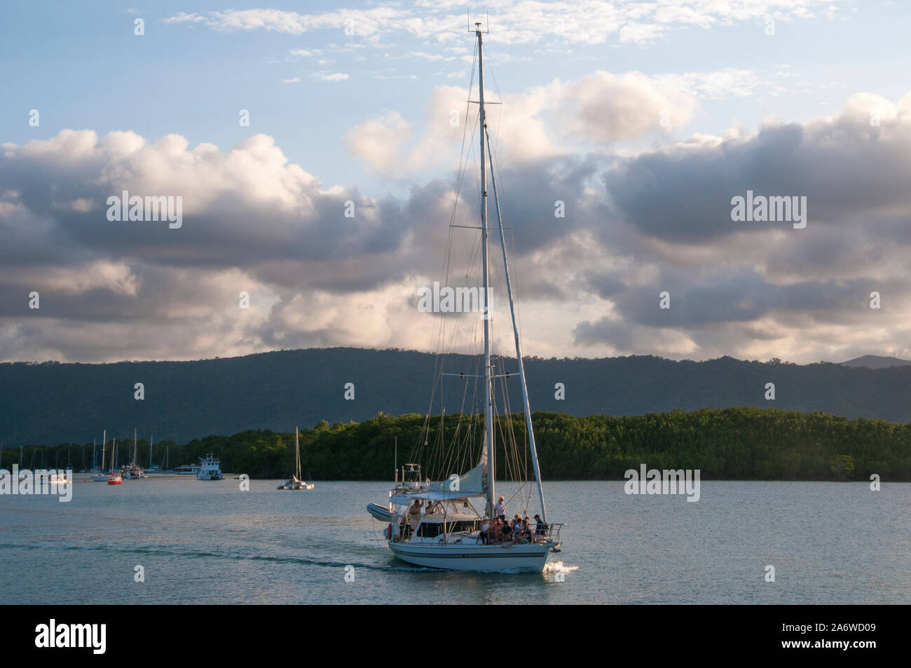 Yacht sailing out of Dickson's Inlet, Port Douglas, an upscale tourist destination in tropical North Queensland, Australia Stock Photo