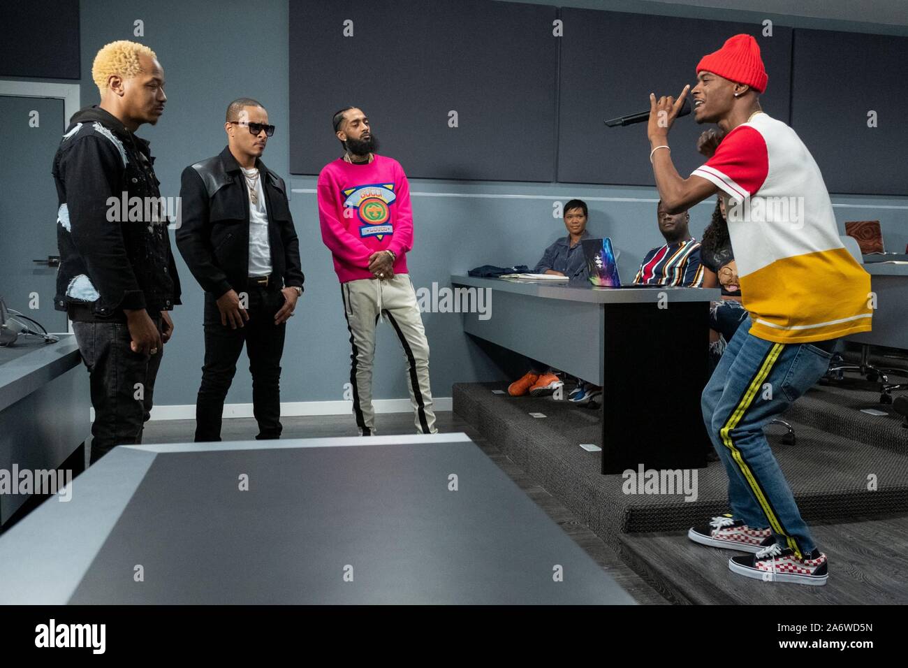 RHYTHM + FLOW, (aka RHYTHM & FLOW, aka RHYTHM AND FLOW), from left: judges Mars, T.I., Nipsey Hussle, contestant Inglewood IV, 'Los Angeles Audtions', (Season 1, ep. 101, aired Oct. 9, 2019). photo: Adam Rose / ©Netflix / Courtesy: Everett Collection Stock Photo