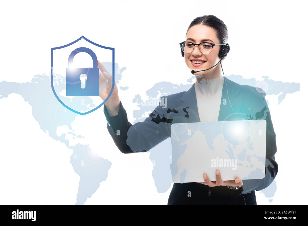 call center operator holding laptop while pointing with finger at ...