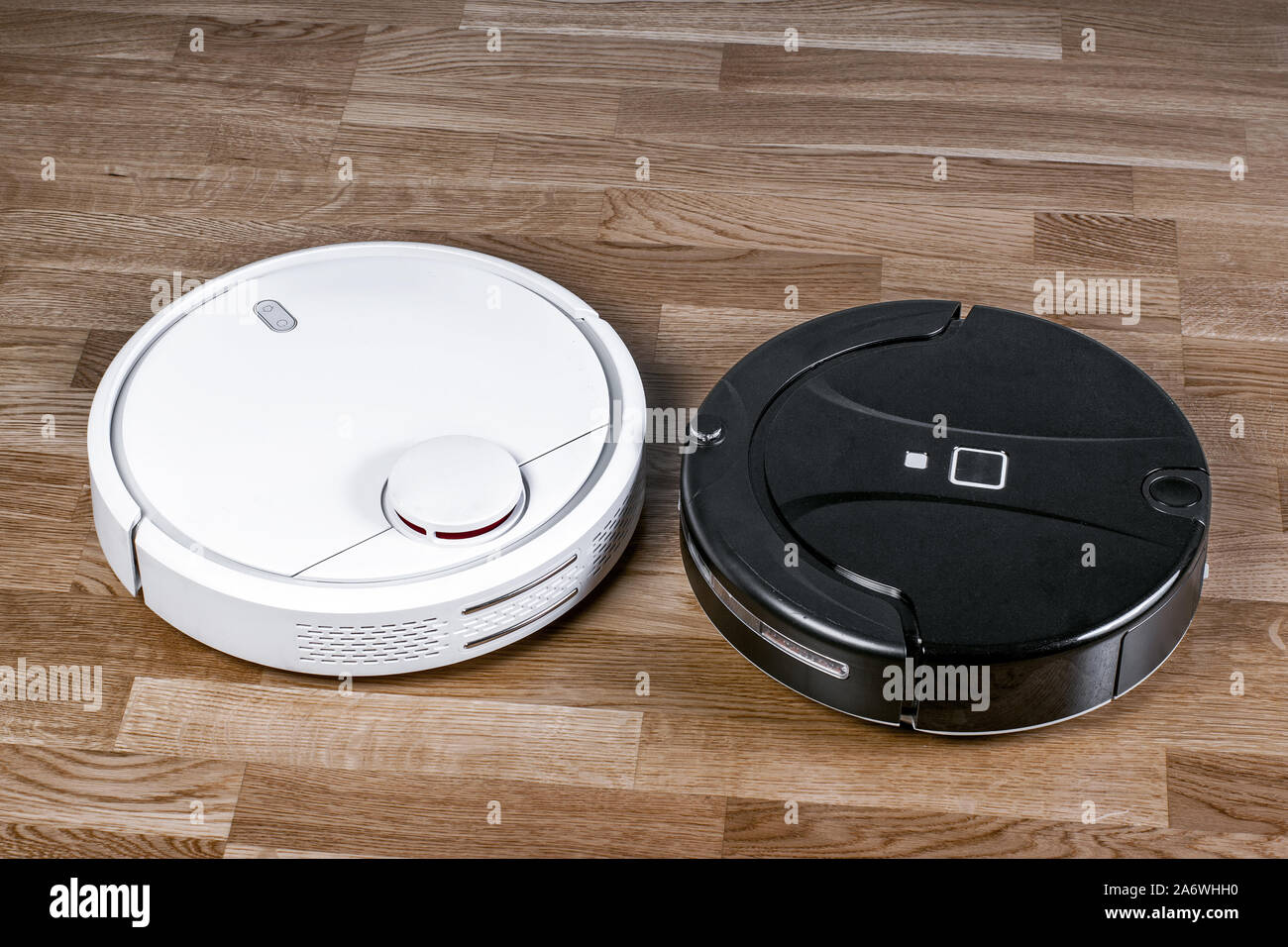 two different Robotic vacuum cleaners illustrating problem of choosing