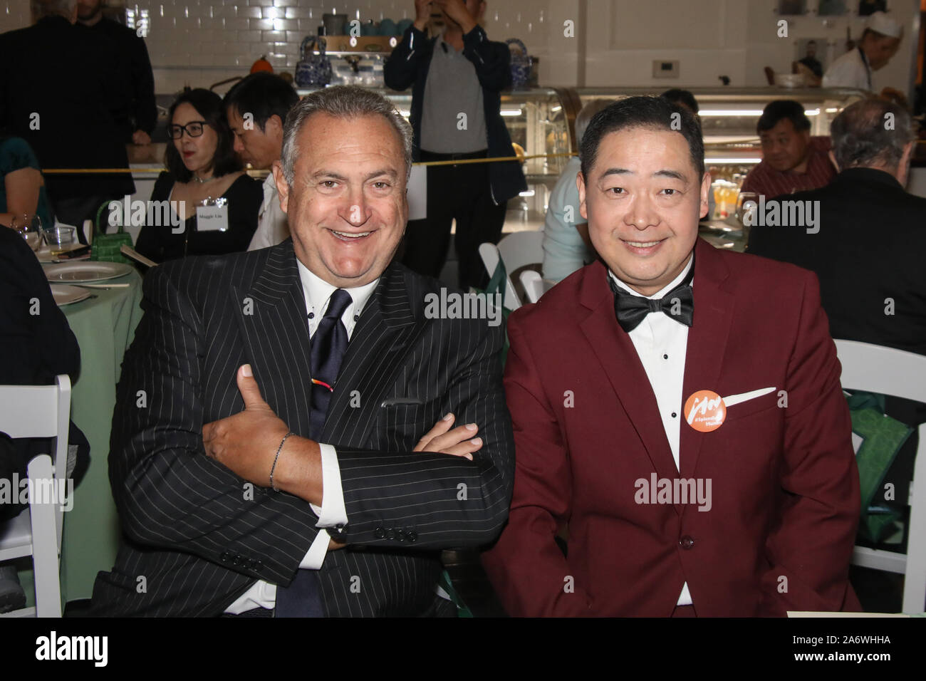 Santa Ana, California, USA. 23rd August, 2019. TV host Joey Zhou and  Celebrity Chef Antonio Cagnolo celebrate the introduction of a Chinese  language menu and Chinese-Italian cuisine at Quattro Caffe located at