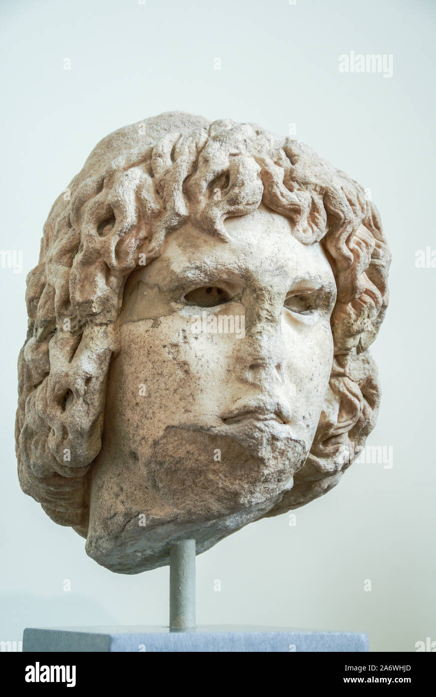 Damaged statue head of a youth - National Archaeological Museum, Athens, Greece Stock Photo