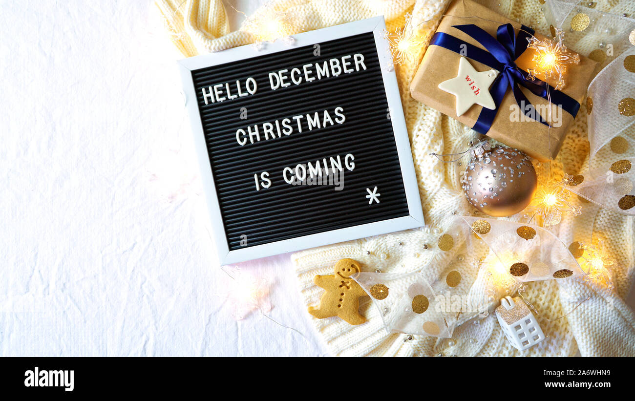 On Trend Stylish Christmas Flat Lay Cozy In Bed Or Indoors With Warm Sweater Gifts And Letter Board Spelling Hello December Christmas Is Coming Wi Stock Photo Alamy