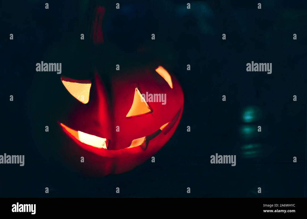 Glowing Halloween Pumpkin With Face With Light With Dark Blue Background Helloween Concept 31 October Stock Photo Alamy