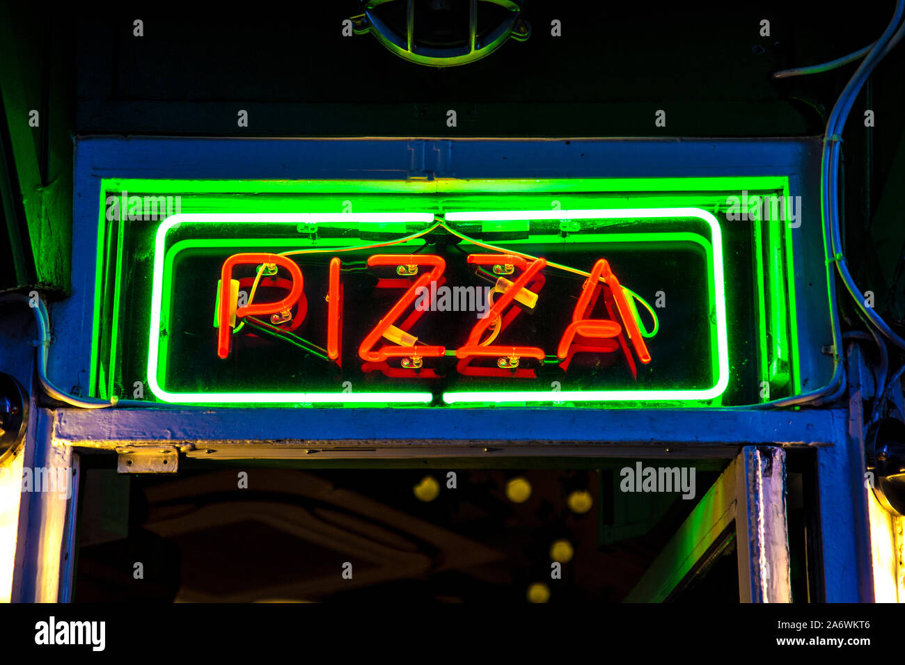 Neon sign for PIzza at night in Soho, London, UK (Pizza Pilgrims) Stock Photo