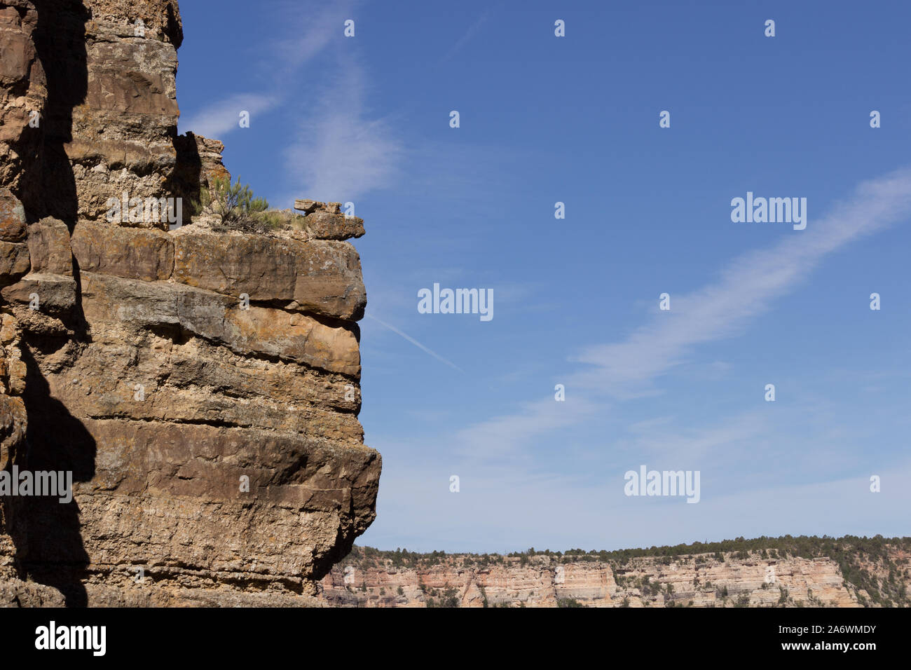 Scenic, sweeping view of vertical cliff in the Grand Canyon against a ...