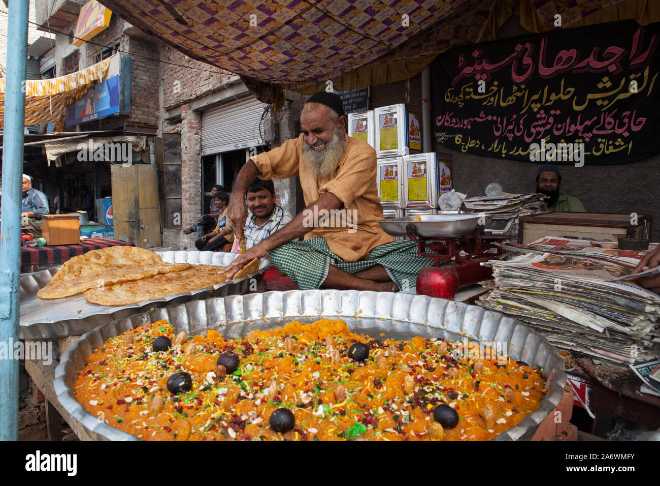 Vendor selling halwa (indian sweet) in the old city of Delhi Stock Photo