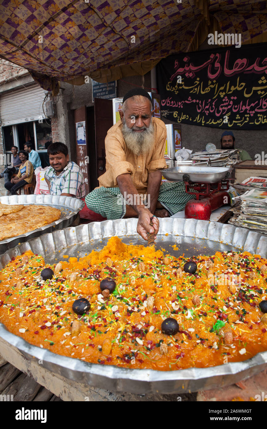 Vendor selling halwa (indian sweet) in the old city of Delhi Stock