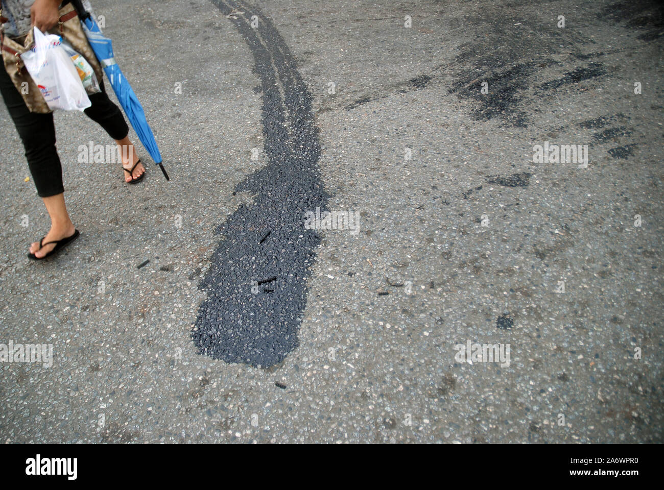 Oil leak from the engine on the asphalt, Yangon, Myanmar, Asia Stock