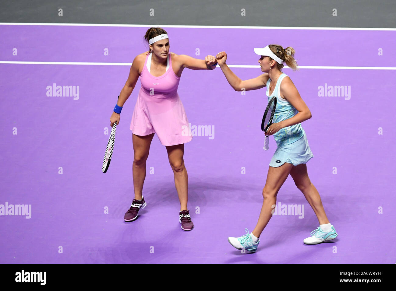 Shenzhen, China. 28th Oct, 2019. Elise Mertens (R) of Belgium/Aryna Sabalenka of Belarus compete during the doubles round robin match against Anna-Lena Groenefeld of Germany/Demi Schuurs of the Netherlands at the WTA finals Tennis Tournament in Shenzhen, south China, Oct. 28, 2019. Credit: Liang Xu/Xinhua/Alamy Live News Stock Photo