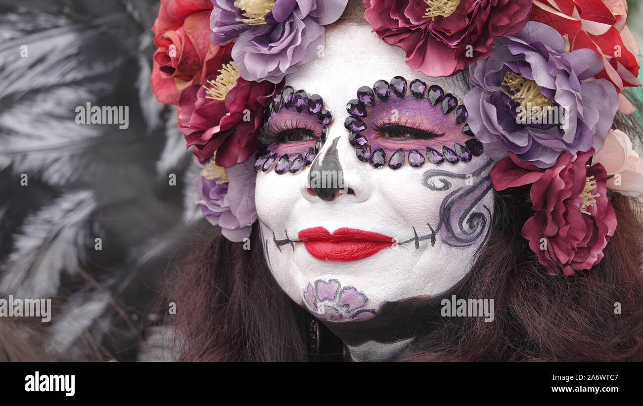 Gorgeous sugar skull (catrina) makeup on a woman attending Dia de los Muertos event at Mission San Luis Rey. Stock Photo